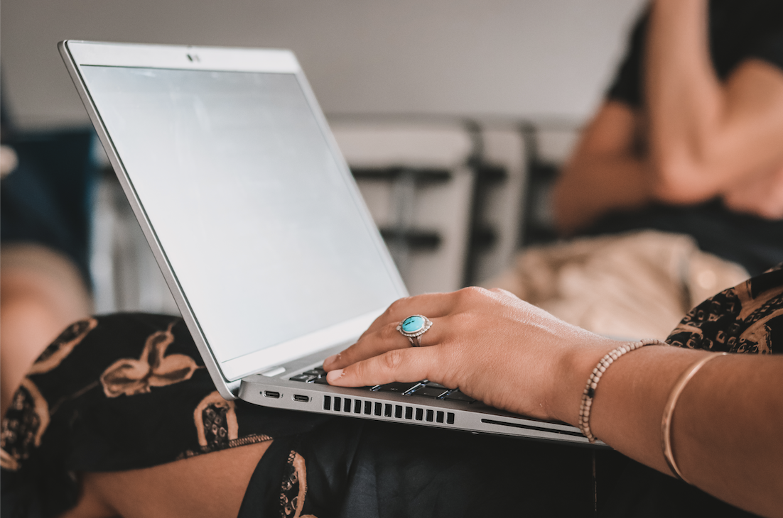 Photo of hand working on a computer