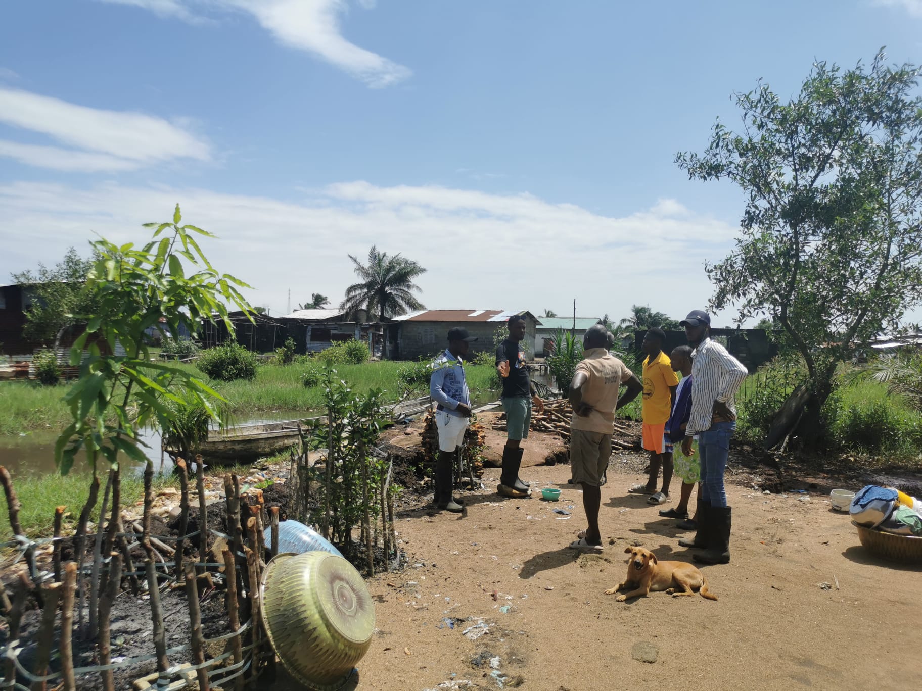 Person chatting by the water's edge in Liberia